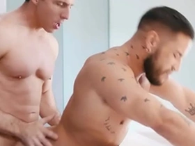 Tattooed and muscled studs enjoy barebacking anal action